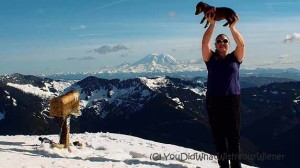 Girls holds Dachshund on the top of Mailbox Peak