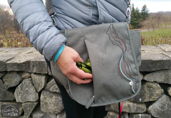 The outside slip pocket is awesome for storing dog poop bags